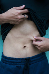 Midsection of woman with hands