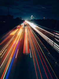 High angle view of light trails on road at night