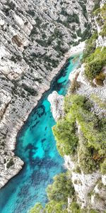 High angle view of rock formations on sea shore