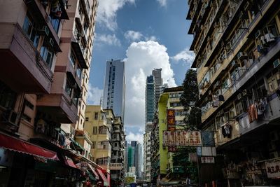 Low angle view of buildings in city against sky