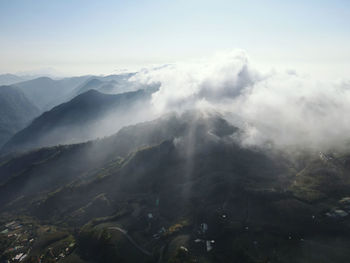 Aerial view of mountains against sky