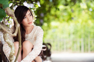 Portrait of young woman looking away