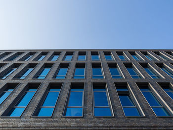 Low angle view of building against blue sky