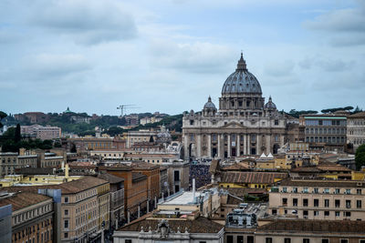 View of st. peter's basilica in crpmeagainst cloudy sky