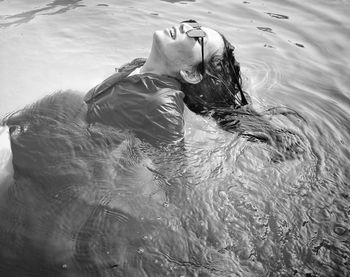 High angle view of woman swimming in water