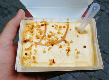 Close-up of hand holding ice cream