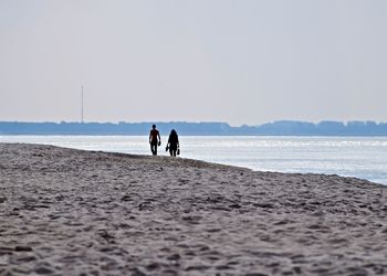 Scenic view of beach against clear sky