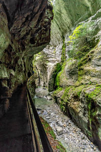 Narrow road passing through mountains