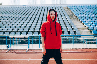 Athlete standing on running track at stadium