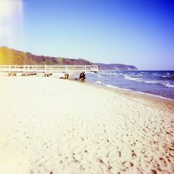 Scenic view of beach against clear sky