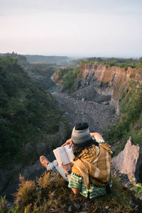 Relax by reading a book in the wild. kaliadem cliffs, yogyakarta