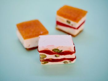 Close-up of cake on table against white background