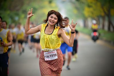 Full length of a smiling young woman