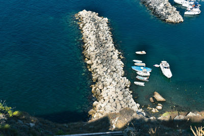 High angle view of sailboats on sea shore