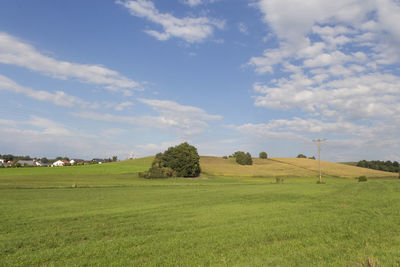 Countryside landscape against clouds