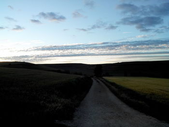 Road passing through field