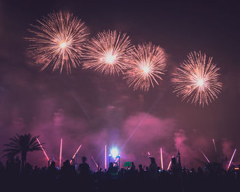 Firework display at night
