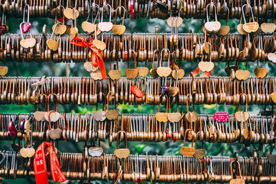 Full frame shot of locks hanging on railing