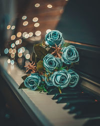 High angle view of illuminated lighting equipment on piano 