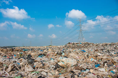 Stack of garbage against blue sky