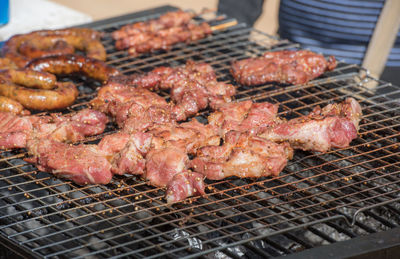 High angle view of meat on barbecue grill