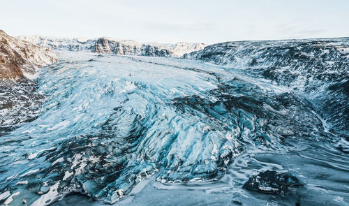 Aerial drone top view glacier iceland, melting ice, climate change and global warming concept