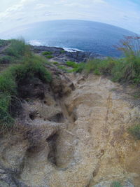 High angle view of sea shore against sky