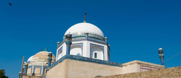 Low angle view of building against blue sky