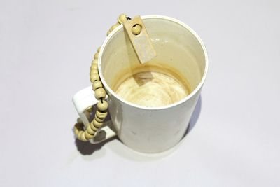 High angle view of coffee on table against white background