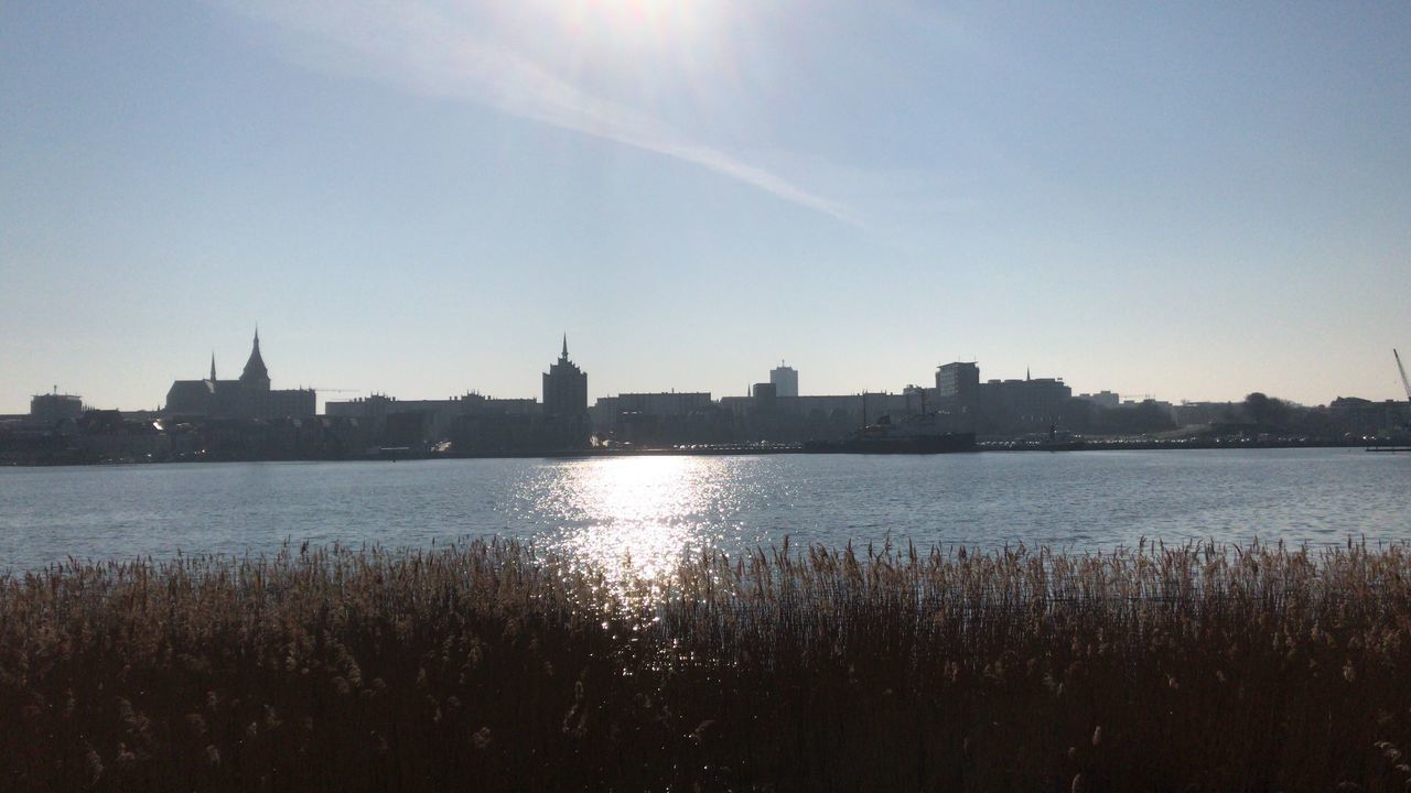 RIVER AND BUILDINGS AGAINST SKY