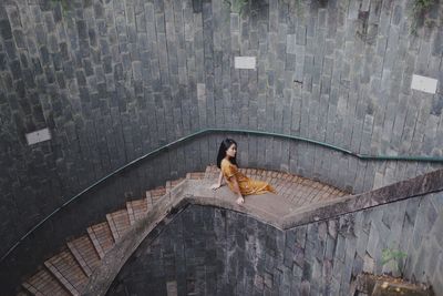 High angle view of woman on staircase