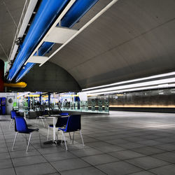 Empty chairs and tables in restaurant