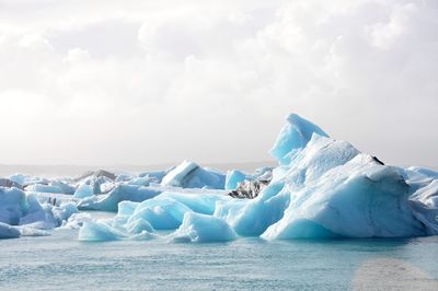 Scenic view of frozen sea against sky