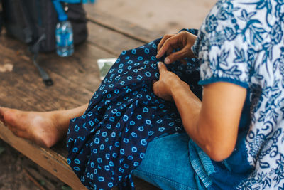 High angle view of woman sitting at home