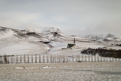 Scenic view of land against sky during winter