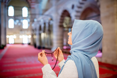 Midsection of women standing at temple