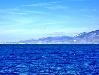 Scenic view of sea against blue sky