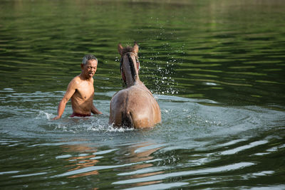 People swimming in lake