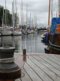 Boats moored at harbor