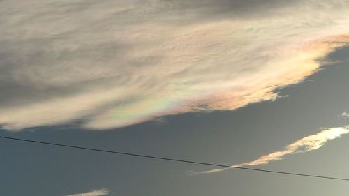 Low angle view of cables against sky during sunset