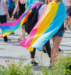 Low section of people walking on street