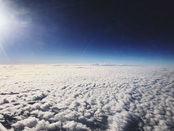 Snow covered landscape against sky