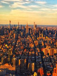 High angle view of city buildings during sunset