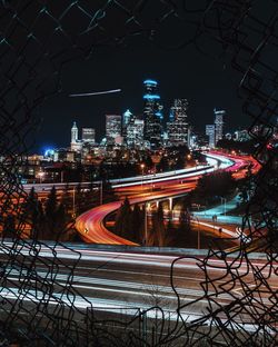 Illuminated light trails on road at night