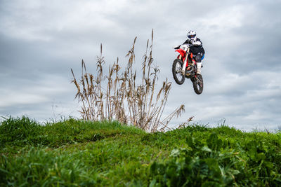 Bicycle on field against sky