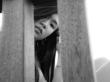 Close-up portrait of a young woman looking down