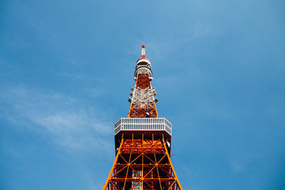 Low angle view of tower against blue sky