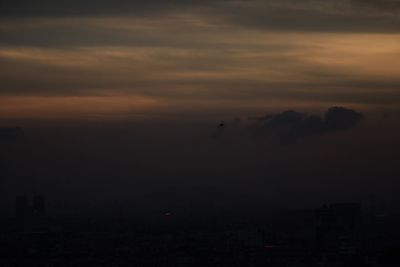 Scenic view of landscape against cloudy sky