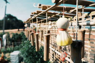 Close-up of lighting equipment hanging outside building