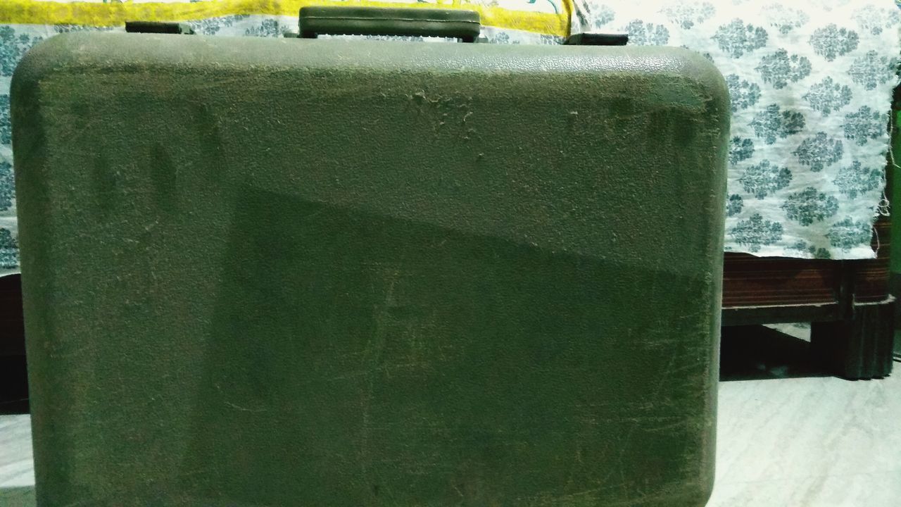 CLOSE-UP OF GREEN WALL WITH METAL GRATE